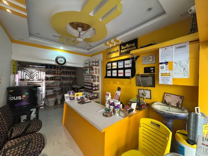 Best Cement Shops In Hiranpur displaying stacks of UltraTech and ACC cement bags for construction.