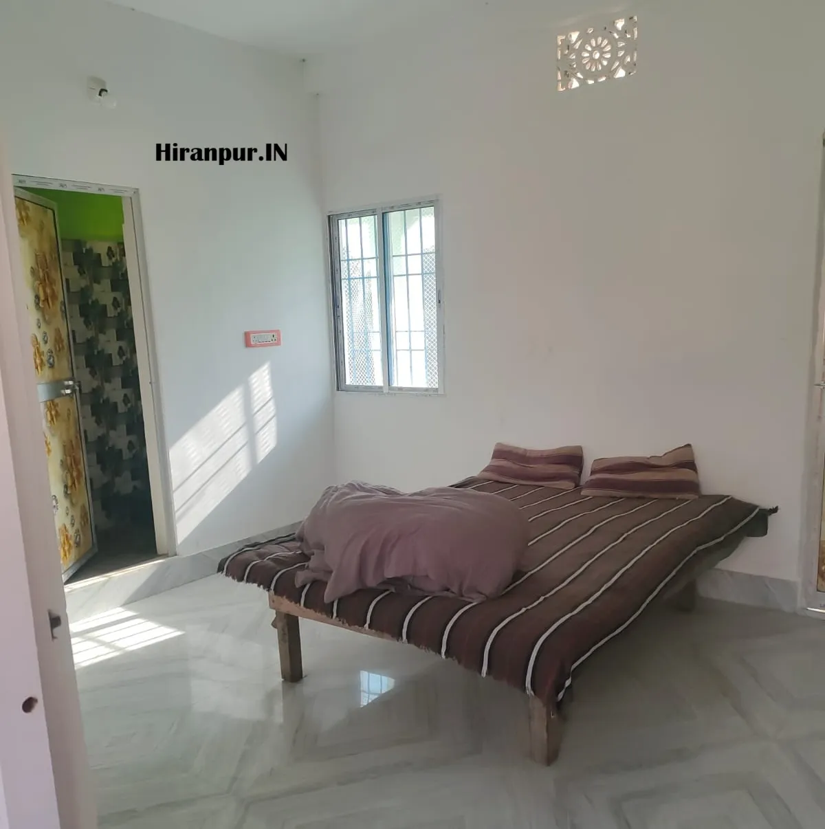 A residential house building offering rent rooms in Hiranpur near Block Office and Subhash Chowk area for families and students.